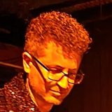 Greg Spero at a keyboard on stage